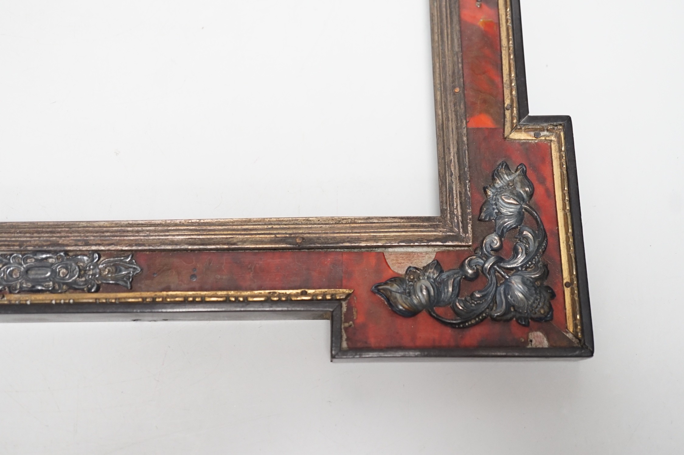 A 19th century red tortoiseshell and metal mounted picture frame. 27 x 31cm